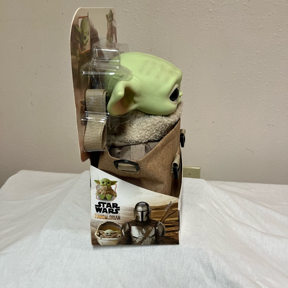 NWT Disney Grogu in backpack. And make noise when you squish his left hand.